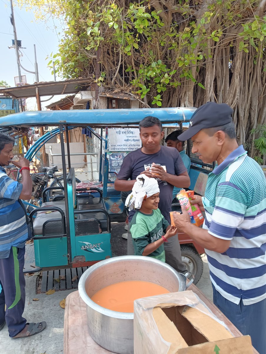 Distribution of Fruit juice by Ramakrishna Mission, Nabadwip to provide relief to the pedestrians in the scorching heat