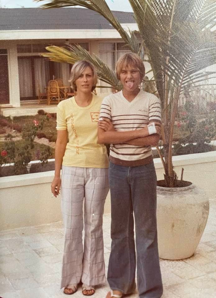 My mother, Mary Jane Henderson Smith, & my late brother, John McCutchen, at our home in Balikpapan, Kalimantan, Indonesia, Aug 1977, where we were drugged and robbed blind, as we slept in our bed, with swords laid out next to us, in case we woke.