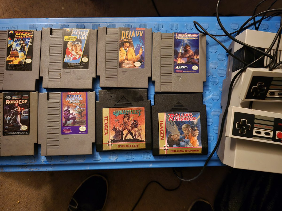 A friend cleans out homes and storage units and gave this NES and a bunch of games today! Deju Vu Robocop Back to the Future Karate Kid Iron Sword Gauntlet More That's an awesome score!