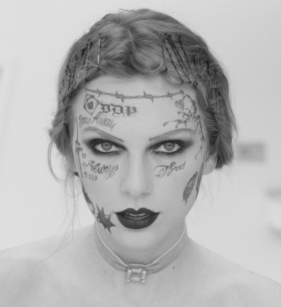 TSwiftNZ's tweet photo. 🎥 | Taylor pays homepage to @PostMalone’s face tattoos in a new still from the ‘Fortnight’ music video #FortnightMusicVideo https://t.co/vxItrN1DQM