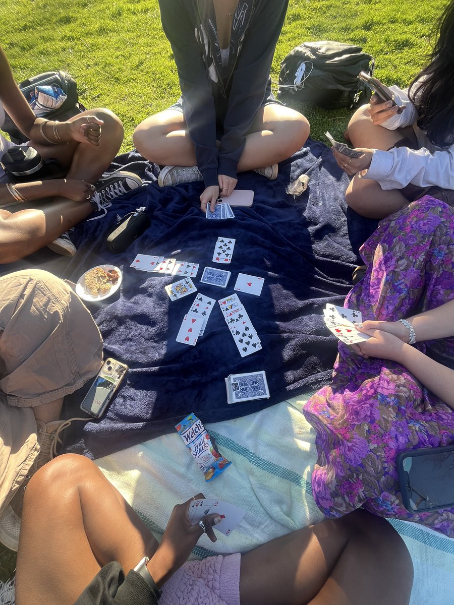 Vassar's tweet photo. Nothing beats a nap followed by a game of cards under blue skies! (Post by Jayda Taylor ‘27) #LibraryLawn https://t.co/8T8USsa5C4