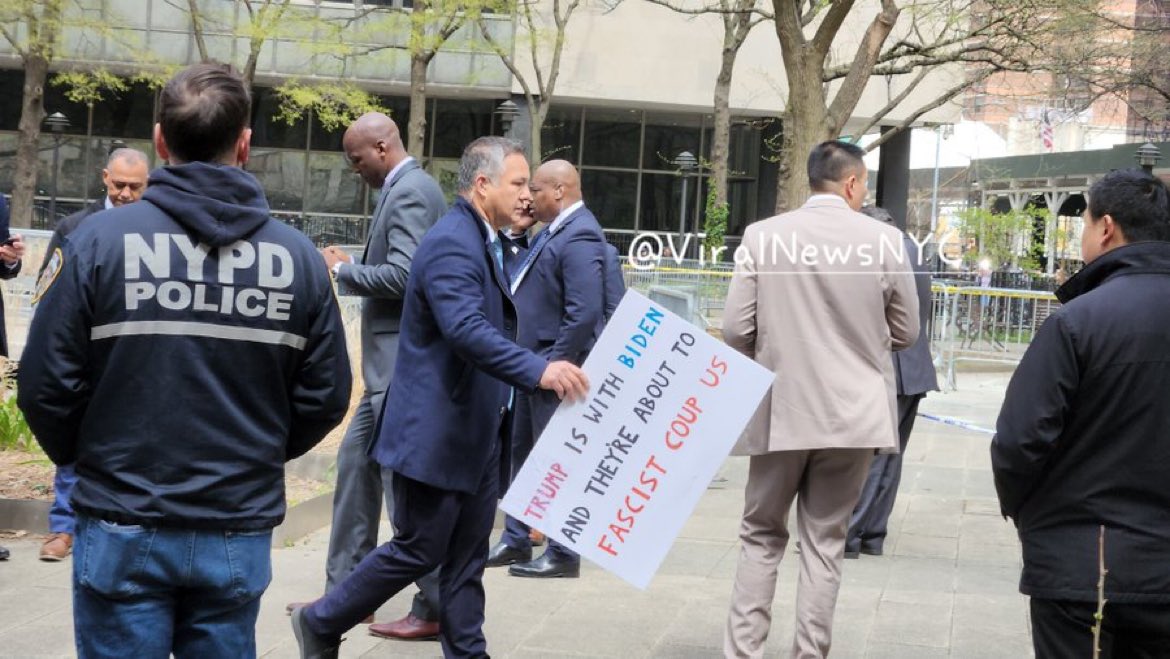 BREAKING: Sign found near the Trump trial courthouse where a man set himself on fire