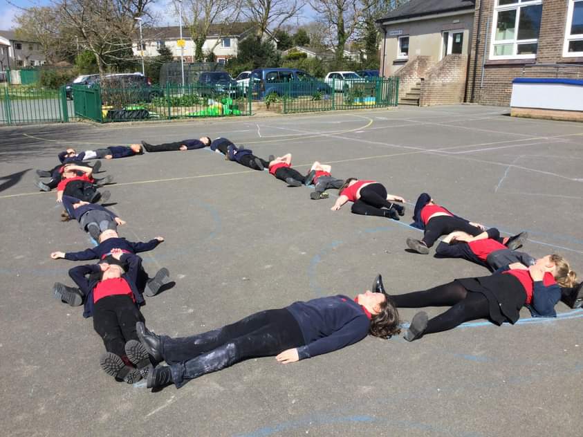 What are Y3 up to I hear you ask? They have just started learning about The Stone Age so they went outside to draw bluestones which were used to create Stonehenge. Each stone is 9m x 3m. Y3 discovered the class could fit round the perimeter & they had lots of fun finding this out