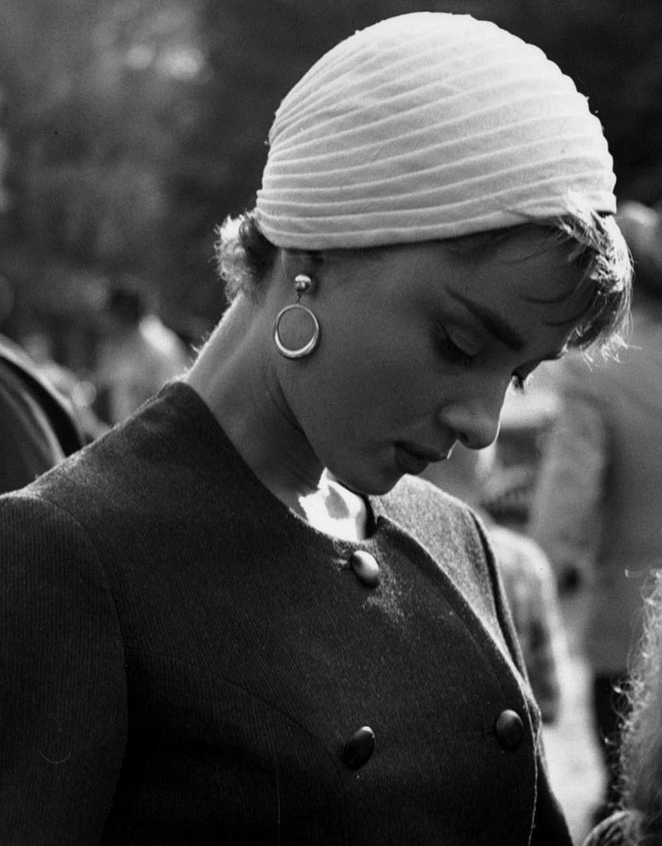 Audrey Hepburn signing autographs on the set of Sabrina, 1954