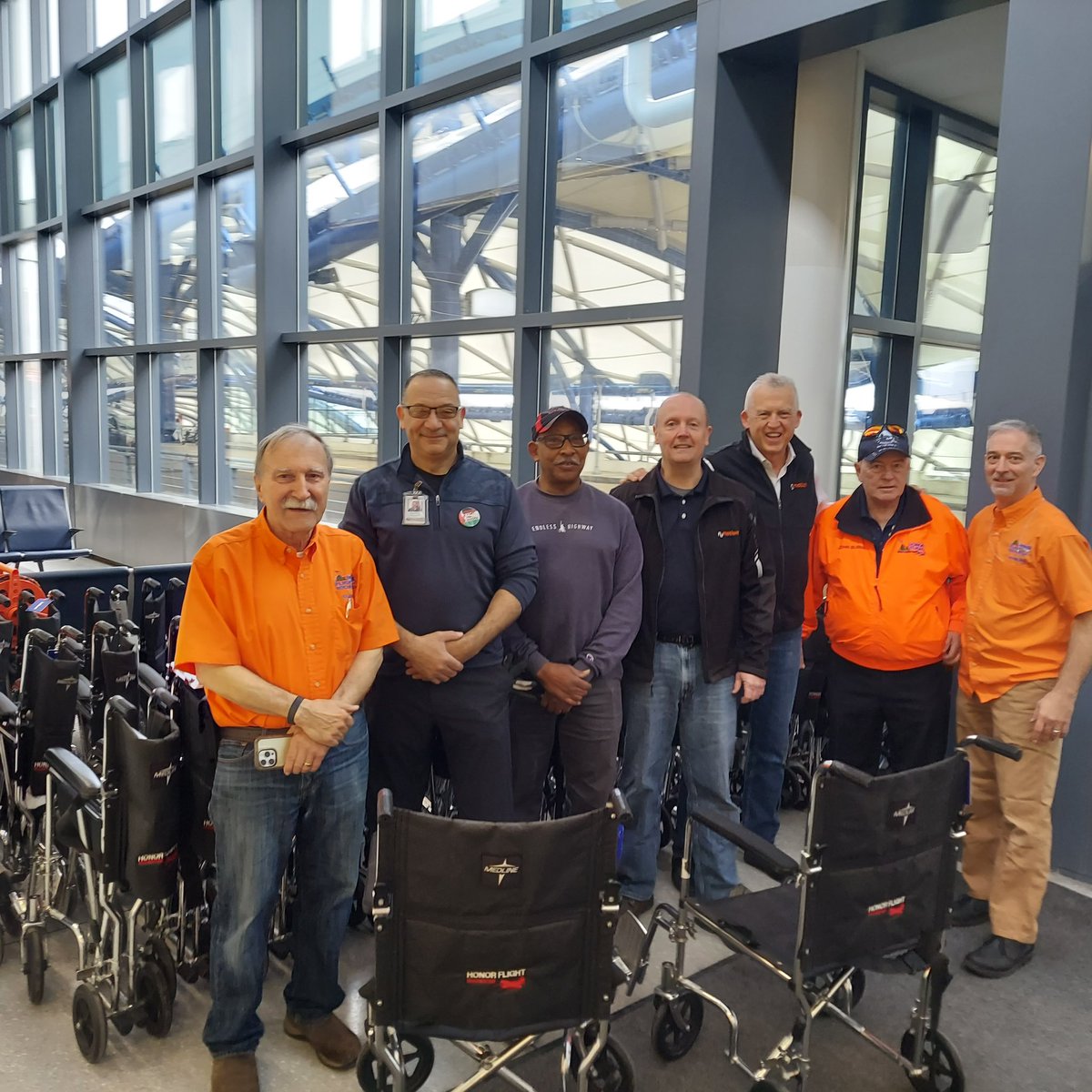 HonorFlightROC's tweet photo. Doug Westerdahl of Numotion (Monroe Wheelchair) receives Proud Benefactor Plaque from President Rich Stewart for their generous support which began with Doug being the Guardian for his father Bruce on M57 in October 2017. Thank you Numotion! #honorflightrochester https://t.co/2phcN5Vb5w