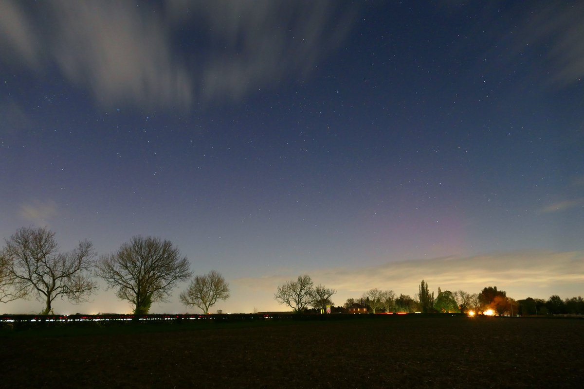 Not the best picture, but just caught the tail end of the short duration outburst before 11pm with some faint red over the village. @chunder10 @MetJam_