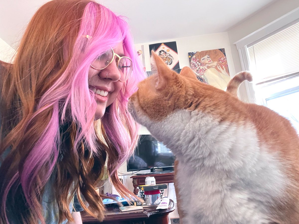 hair dyed today and also me smiling at my cat butter bc he’s my sweetie baby angel <3