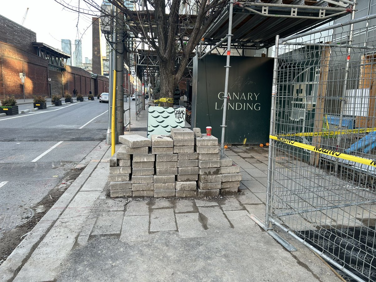 Hi @311toronto construction company building a condo at north west corner Mill & Cherry St has dumped a pile of bricks on the sidewalk. Someone using a wheelchair or mobility device isn’t going to be able to navigate between fence and brick! 🤦‍♀️ @cityoftoronto #WalkTo #VisionZero