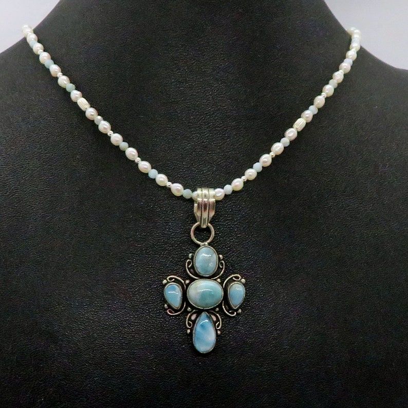 'Larimar Cross Freshwater Pearl Sterling Silver Pendant Necklace - A statement piece for your 80's wedding jewelry collection. Adjustable and Christian-inspired, perfect for any occasion. #Larimar #WeddingJewelry' buff.ly/3FV9U0h