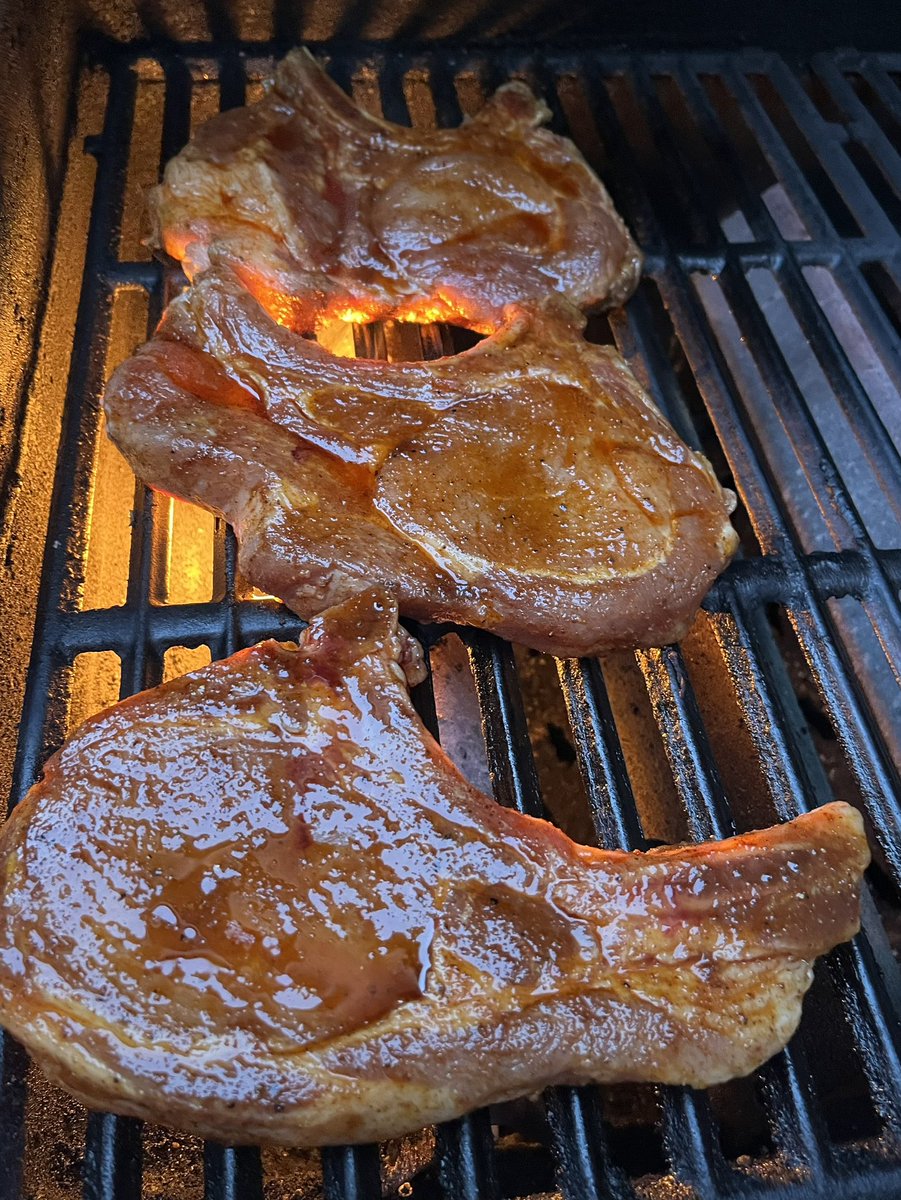 Glazing Pork loin chops on the grill.