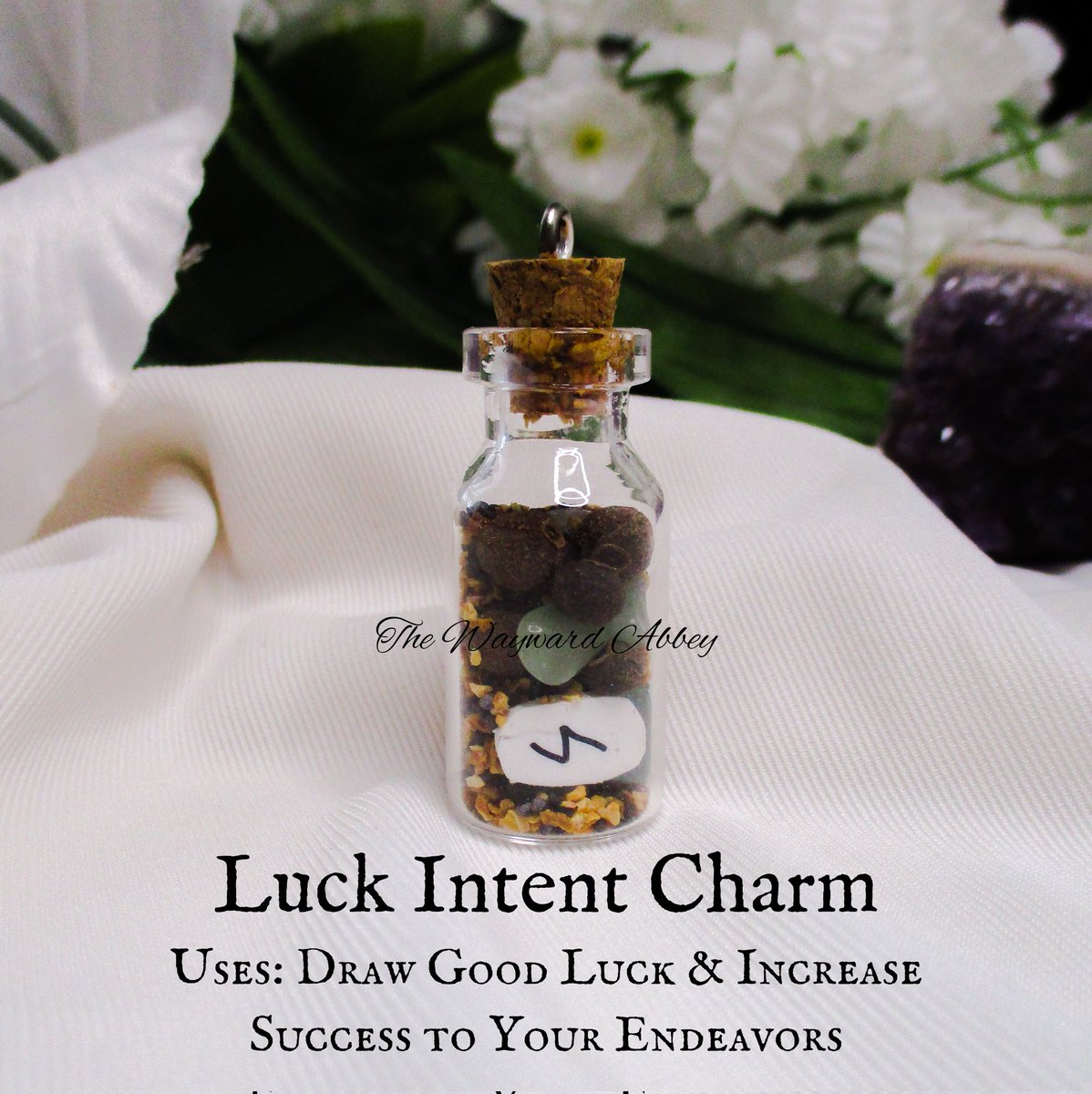 Luck Intent Charm Uses: draw good luck & increase success to your endeavors Herbs, stone chips, & mini rune in a 2mL glass jar to help bring the intent to your life. Comes with satin cord. Other spells available! thewaywardabbeystore.etsy.com/listing/955277… ~Blessings~Courtney