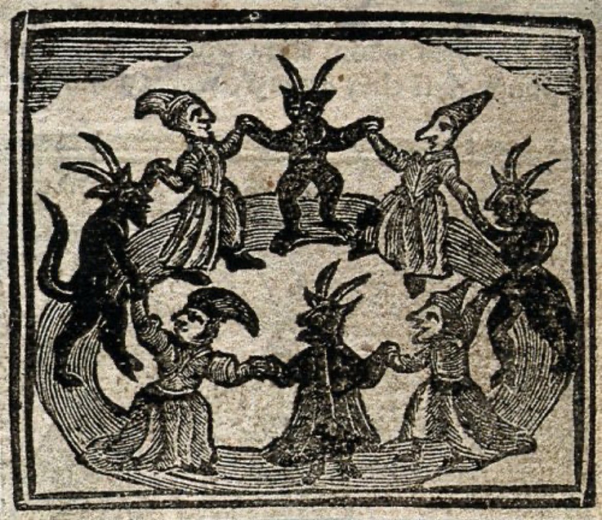 Woodcut from 1720 of witches and devils dancing in a circle.