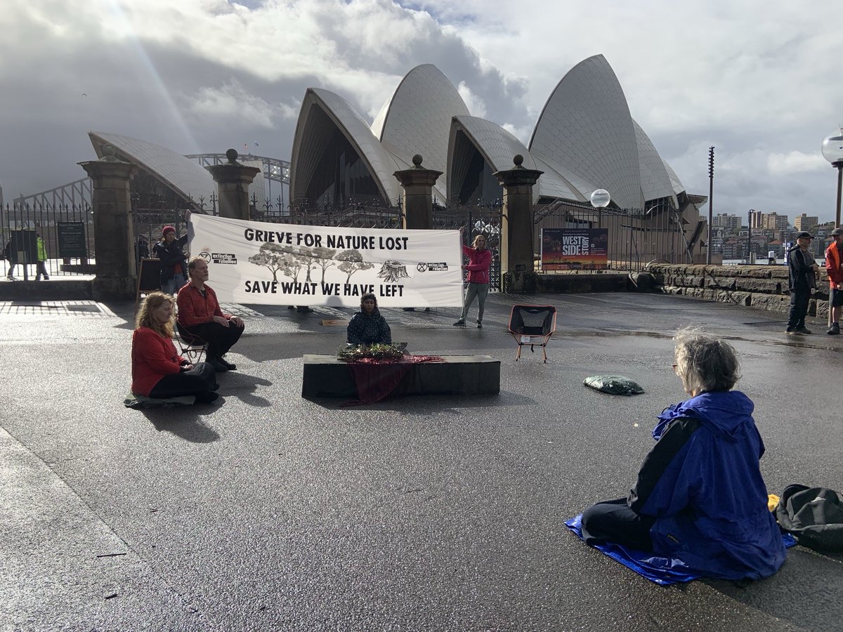Syd Nannas with XR, Red Rebels & Central Coast Nannas in dramatic weather for meditation & mourning lost species at Opera House today. Moving. Heavy police presence irrelevant.