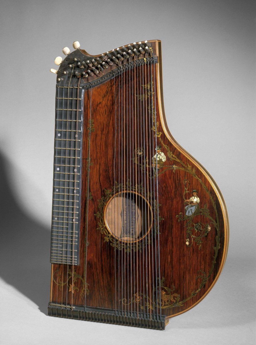 Zither with case, body veneered with rosewood on pine, decorated with marquetry, made by Franz Lehner, 1867. Munich, Germany. Victoria & Albert Museum.