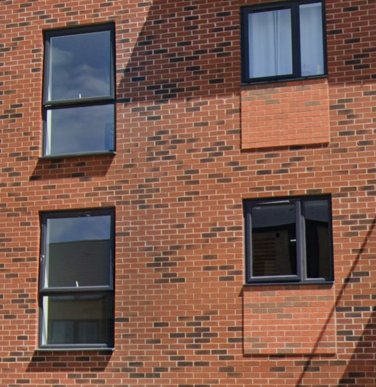 Is this another example of the new silly Part O Building Regulations making homes less nice and windows smaller to no purpose? It looks like it.

The windows on the left are the communal stairwell. We suspect they originally intended to use the same windows for the flats on the