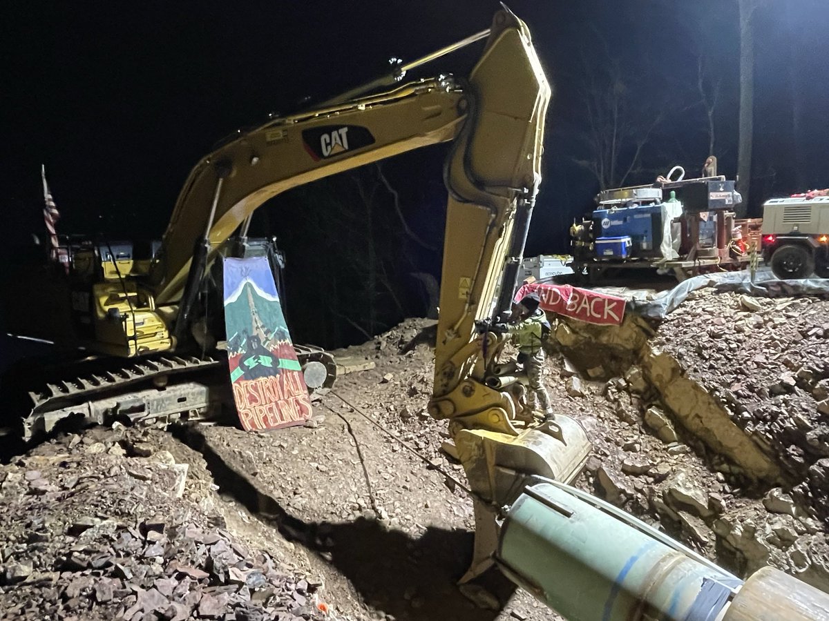 Pipeline fighter Vole has locked herself to a Mountain Valley Pipeline excavator in the Jefferson National Forest, next to the Appalachian Trail. 'What happens in this region and on this mountain matters,' she explained. #NoMVP