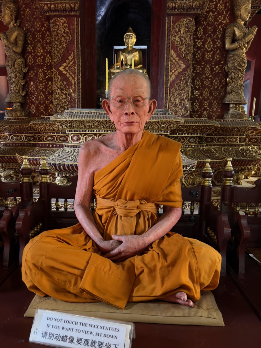 Thai people like to make wax figures of revered monks and place them in temples. The first time I saw one it looked so real I thought it was a monk meditating. These are at Wat Phra Singh in Chiang Mai's old city. #LifeInAThaiForest