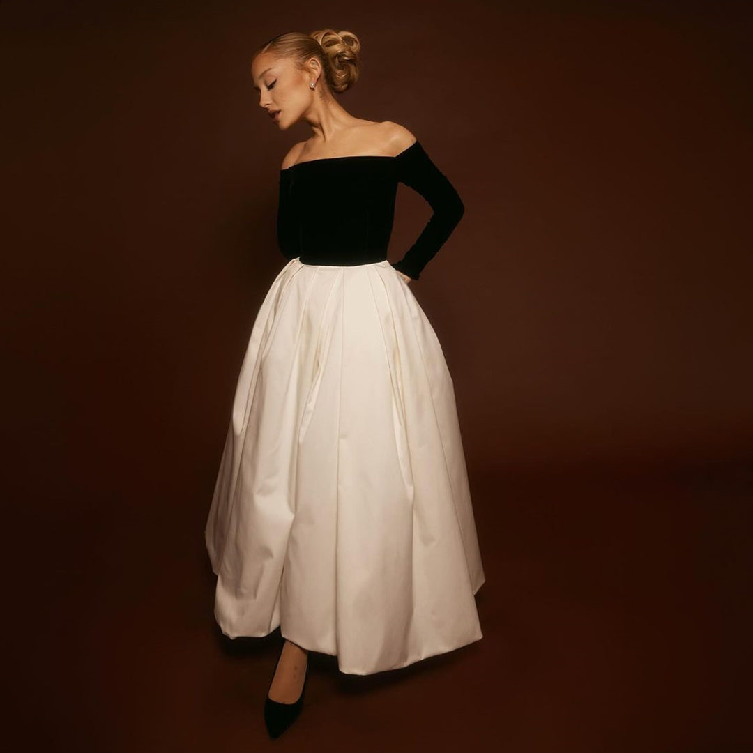Eternally Elegant in Herrera: @arianagrande wore an off shoulder velvet midi dress from the Carolina Herrera Fall Winter 2024 collection to a beauty launch this week. Dress designed by @wesgordon, styled by @mimicuttrell, and photographed by @katiatemkin.