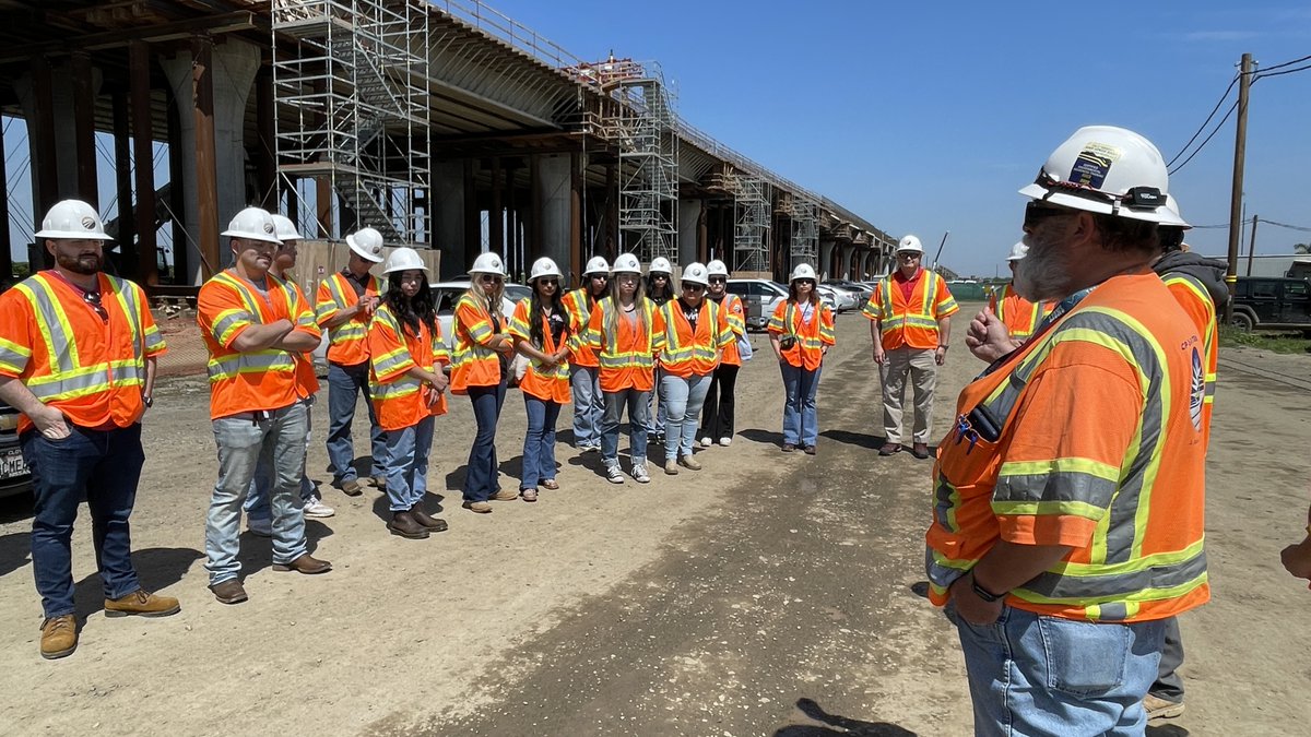 CaHSRA's tweet photo. In collaboration with our long time education partner, Dr. John Green, we took a group of engineering students studying railroad geometry at @Fresno_State to tour construction in the Central Valley! #GoDogs #IWillRide 🚄 🐾 https://t.co/kMkQXD2Hxu
