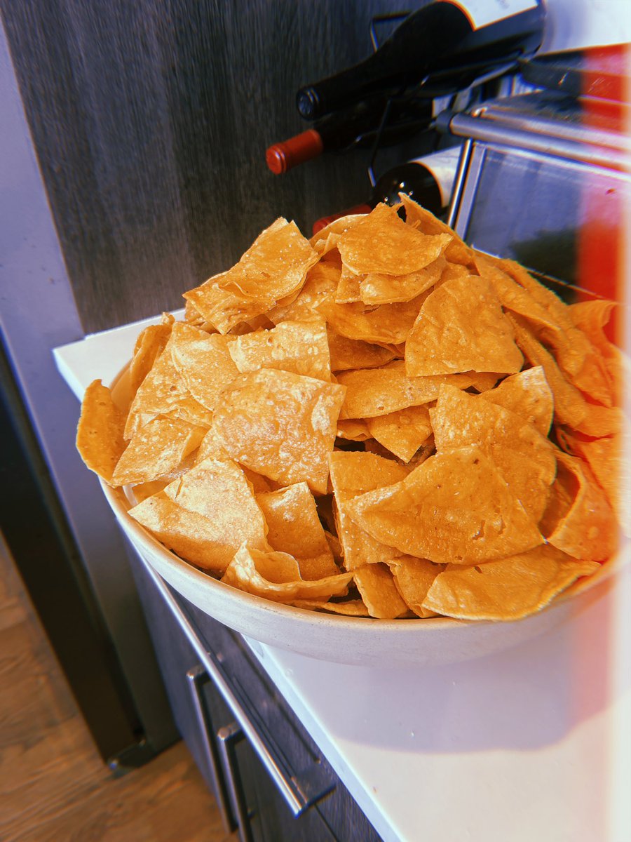 portrait of my largest bowl filled with freshly fried tortilla chips