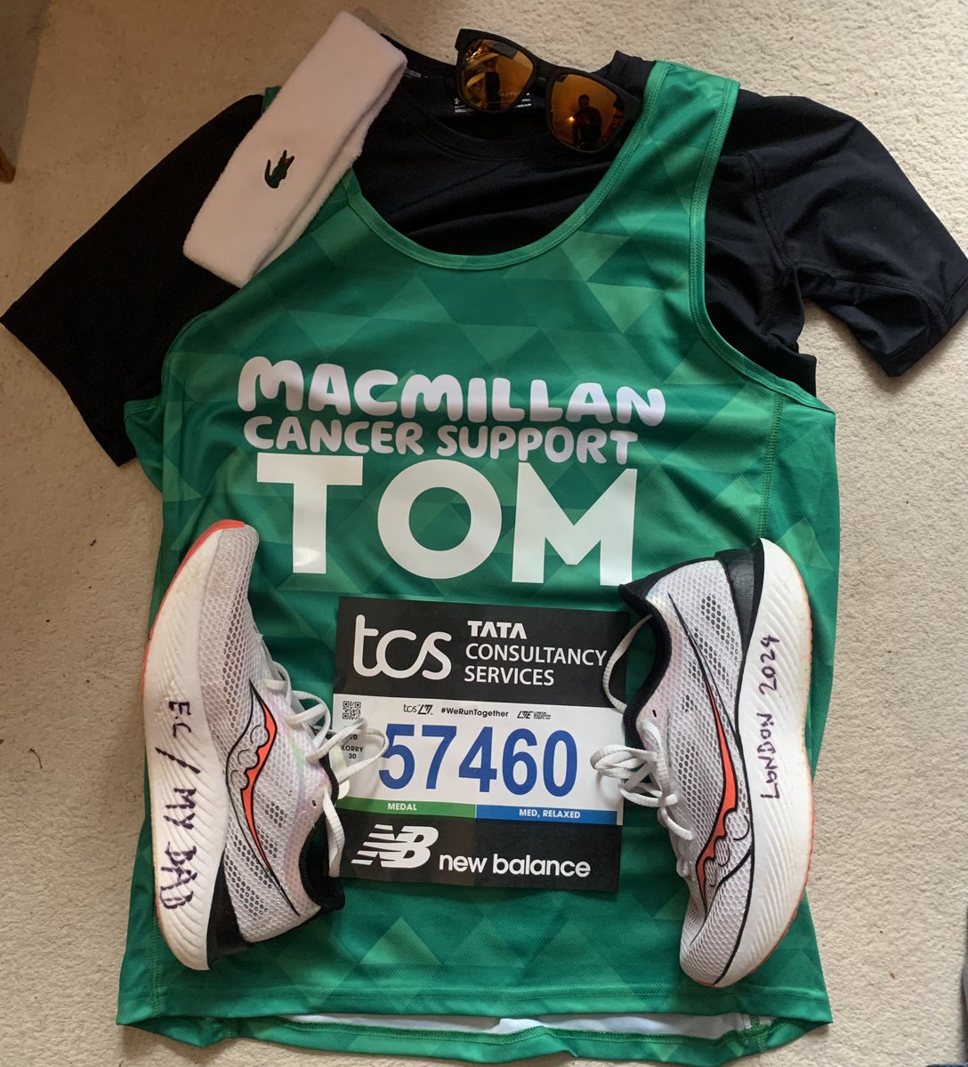 TomElwin's tweet photo. To Greenwich now before tomorrows @LondonMarathon - gear ready. Trusty @SauconyUK’s personalised to remind me how grateful I am for @macmillancancer, @NHSEngland and all our friends and family who have supported us. Support MacMillan here https://t.co/LffluQBMcc https://t.co/E3zztVzCpV
