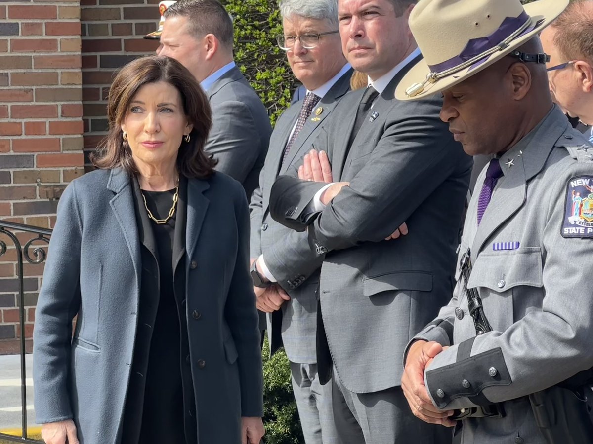 Governor Kathy Hochul joins the other dignitaries before the funeral of fallen Syracuse Police Officer Michael Jensen.