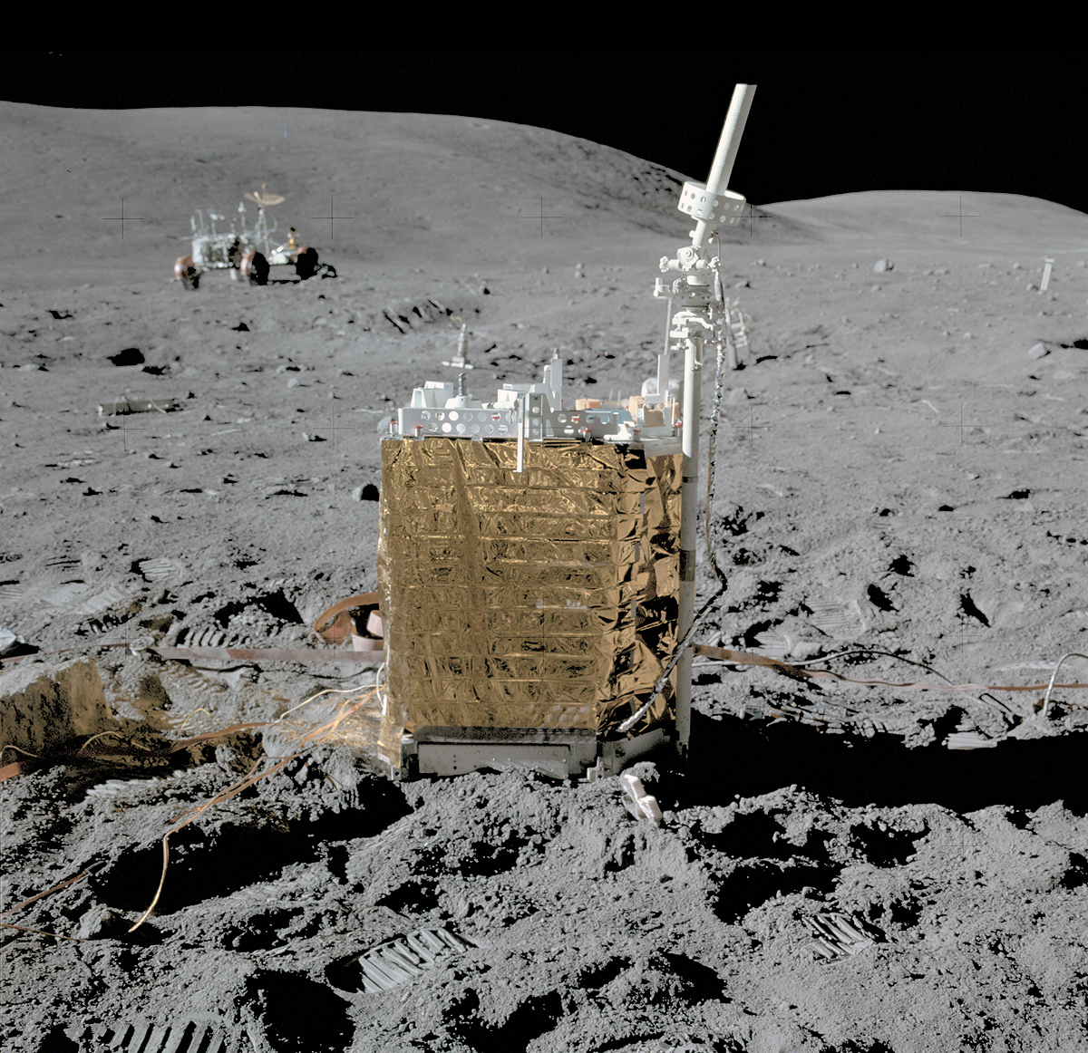 On this day 1972 - Apollo 16 EVA-1 John Young and Charlie Duke have set up the ALSEP. Here we see the central station with the Rover and Stone Mountain in the background. #Apollo16