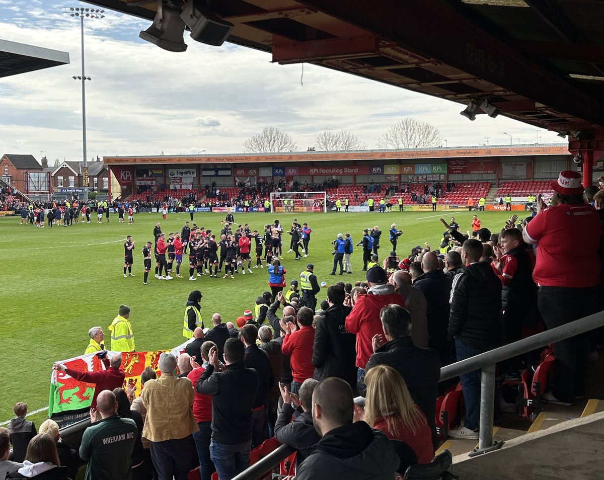 Smiles in the sun on our last away day in League Two 😃 Considering they must still be feeling the effects of the celebrations that was superb 🍻 Nice run out for the Luke Young Corners Appreciation Club 👏 Love the bond between the fans & players ❤️ #WxmAFC @wrexham @Wrexham_AFC