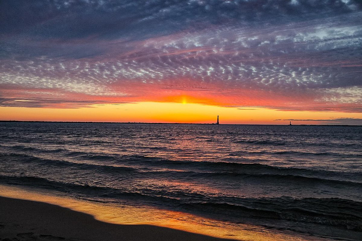Lake Michigan offers front-row seats to breathtaking sunsets every evening. Visit Muskegon to witness the magic of our sunsets. ✨    📸 @little_john73 on Instagram #Muskegon #GreatLakes #puremichigan #westmichigan #travelmi #travelquotes #lakemichigan