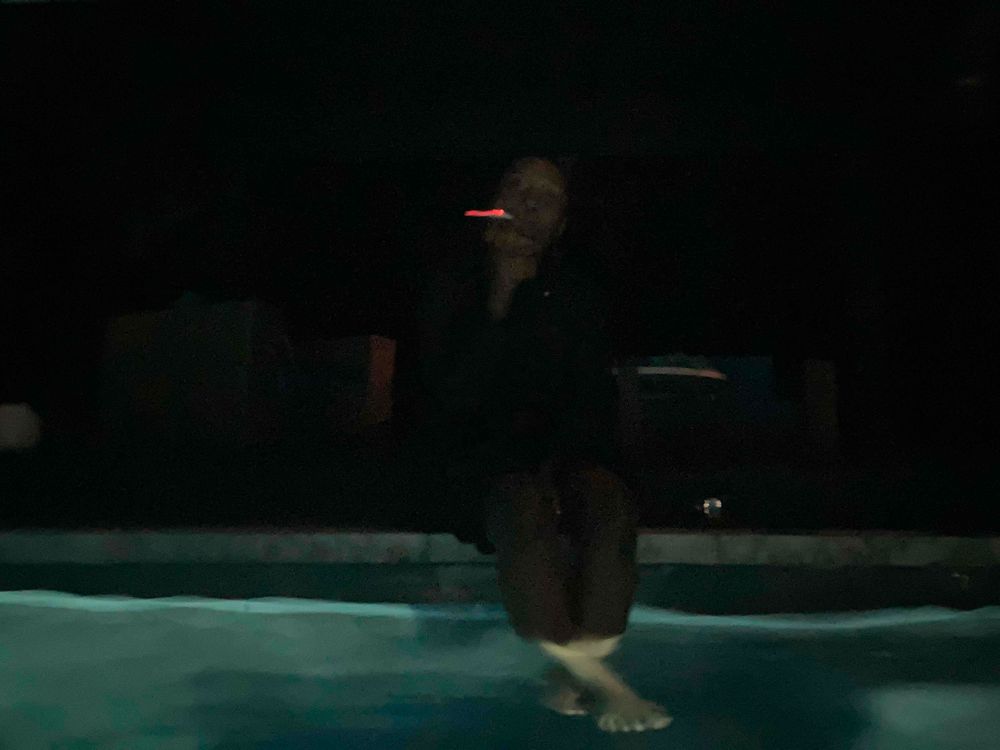 Girlfriend smoking at the pool