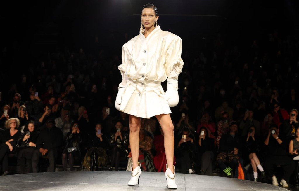 Bella Hadid rocked the runway at Paris Fashion Week, unveiling a unique dress made from Fabrican Spray-on fabric during the Coperni Spring-Summer 2023 fashion show. #PFW #FashionInnovation