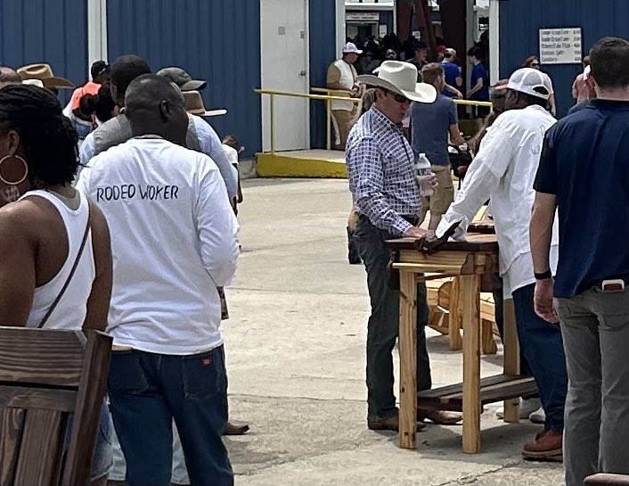 The governor responsible for thousands more prisoners dying in prison casually chatting about handcrafted furniture at the Angola Rodeo.