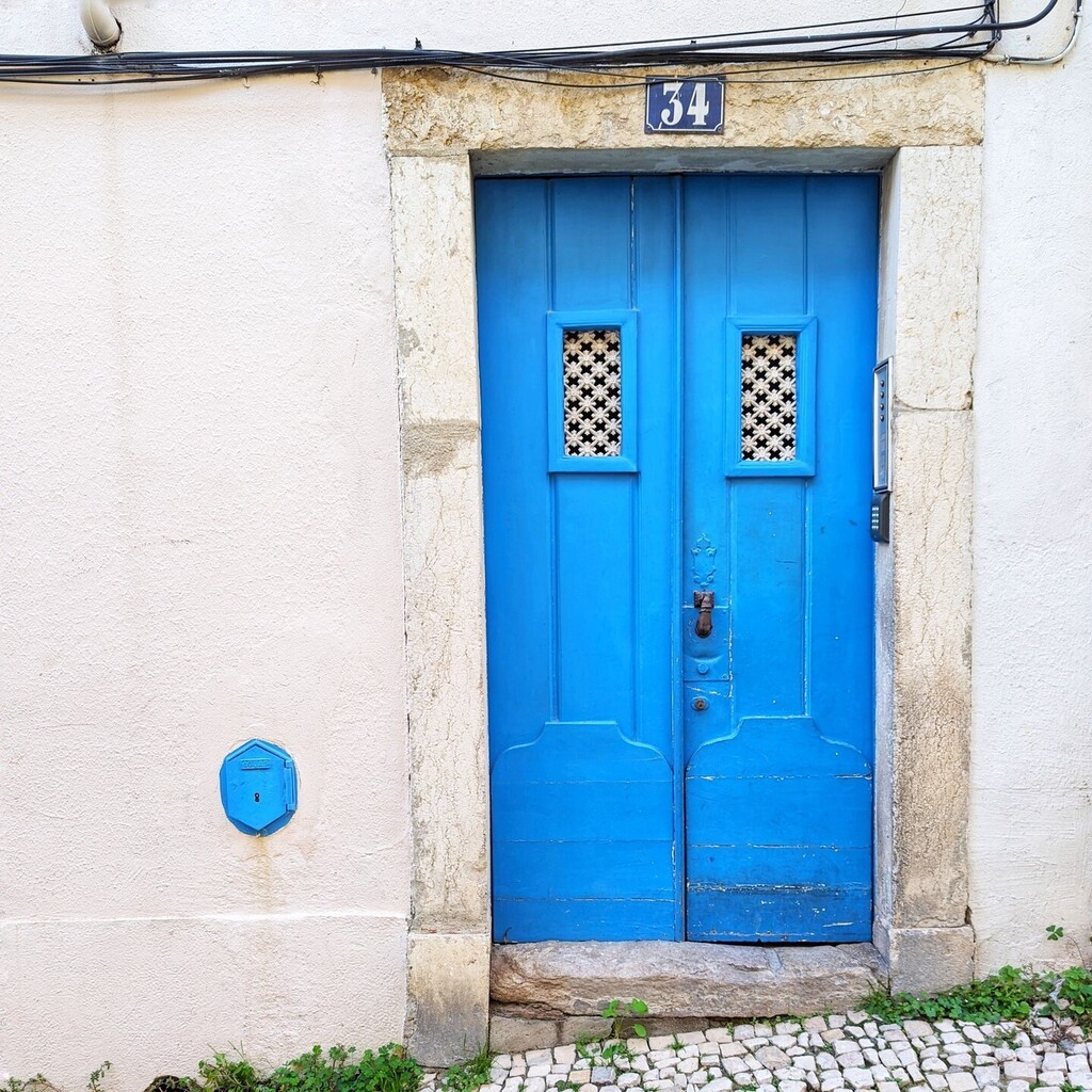 Very cool blue door and matching gas grate in Lisbon. instagr.am/p/C5_hauyPmeJ/