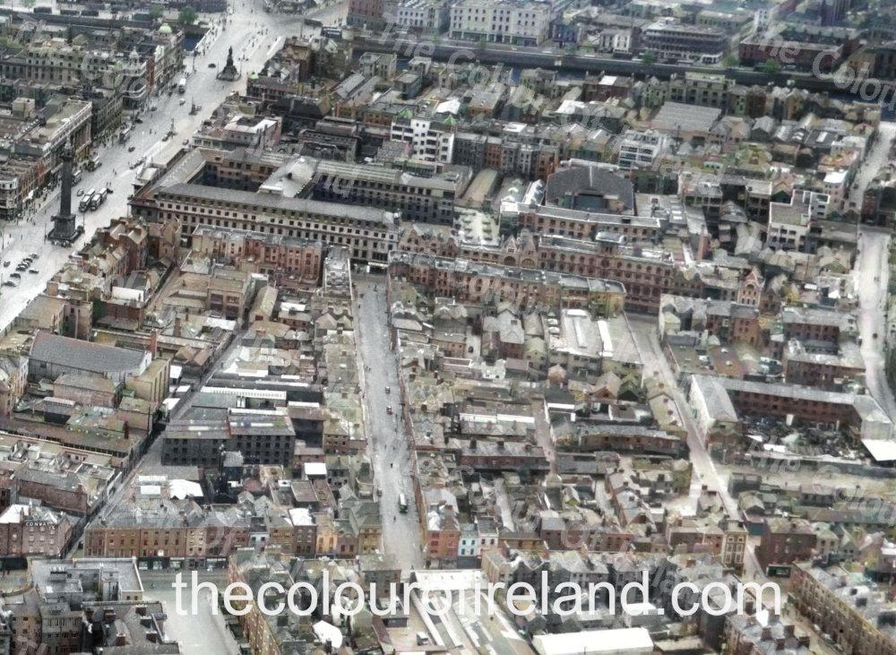 Bringing Ireland's Past o Life 🇮🇪🏗️🧥🥻👖🛒🛍️ My restored and coloured 1949 aerial photo of Dublin features a south-facing view of Moore Street, including old laneways and alleys such as Riddle's Row, Cole's Lane, and Little Denmark Street. Over 100 buildings, including four