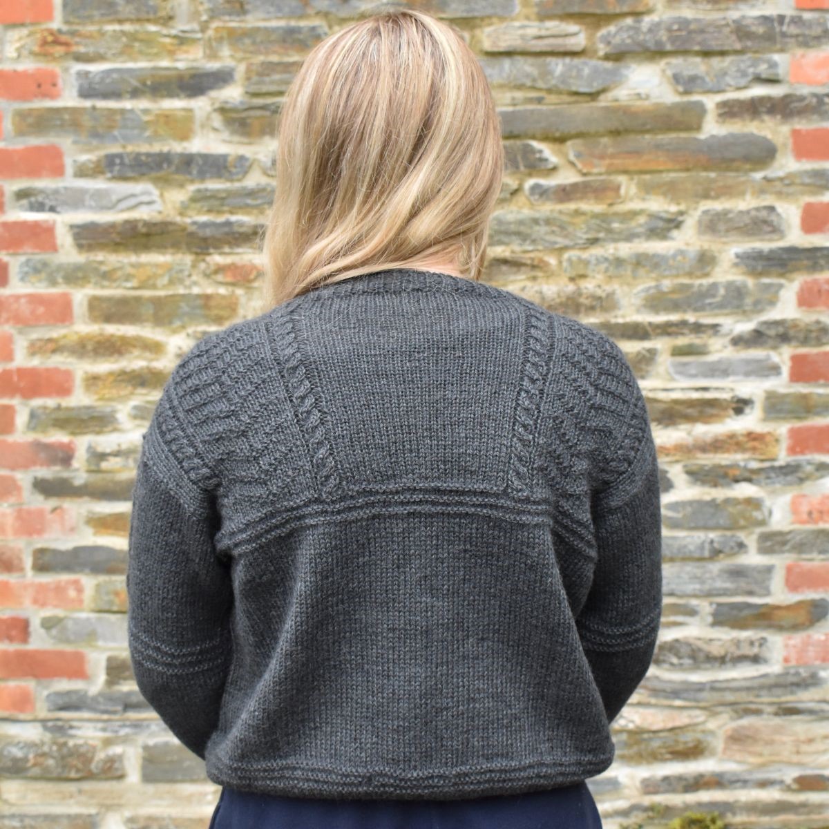 The wonderful waist-length, Ridgeway Gansey Cardigan by Rita Taylor is buttoned to the neck with a gansey-inspired design at the yoke. Made in our Tamar Lustre Blend, DK wool, Rita worked with our Loveny shade, with twelve other colours also available :
blackeryarns.co.uk/ridgeway-ganse…