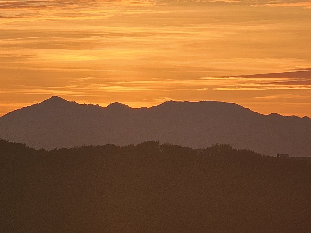 The sun sets over Arran.