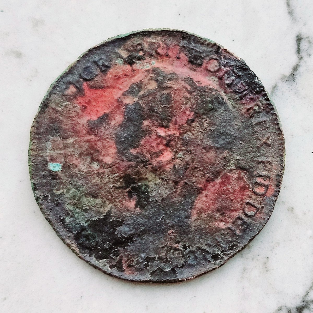 Found this coin digging in the garden yesterday. Looks like George V which means it was probably dropped by people who built or lived in our house first. I was touched by that. My daughter thinks it looks radioactive.