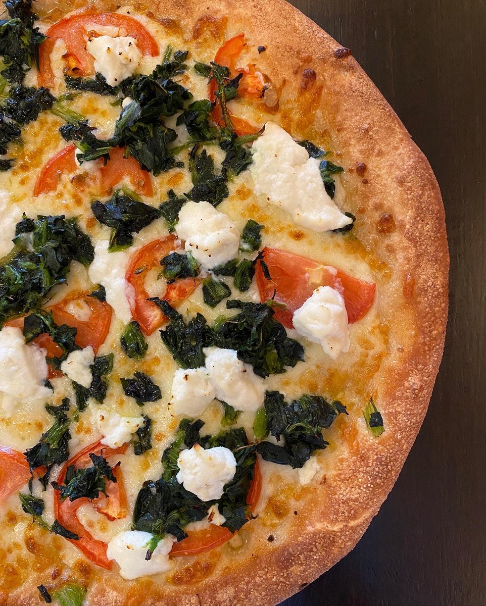 This one is for the white pizza lover!  🍕🤍 Feast your eyes on our Spinach, Ricotta & Tomato Pizza with garlic oil. 

#pizzagram #thisisforyou #whitepizza #specialtypizza #vegetarianpizza #vegetarian #pizzatime #pizzeria #pizza #pizzas #spinach #tomatoes #ricottacheese #ricotta