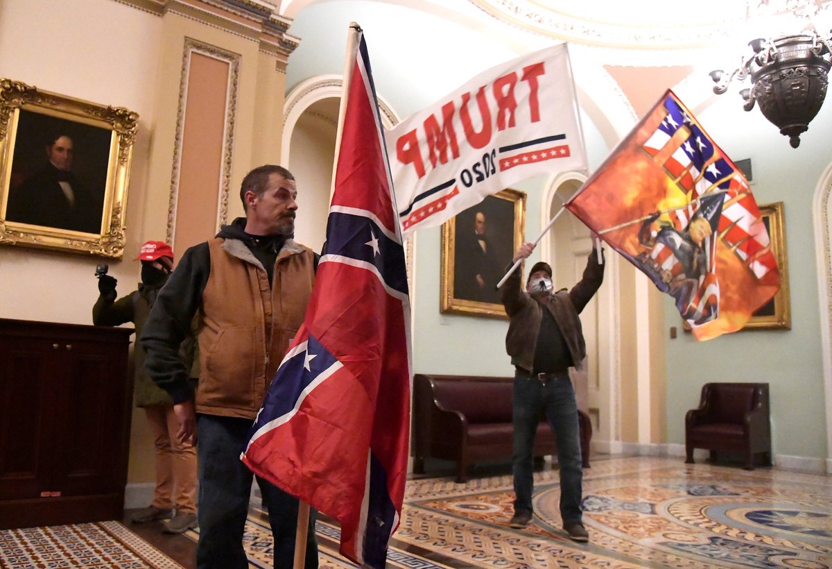 The same people getting triggered about the flying of the Ukrainian flag in the Capitol have called these people 'patriots.'