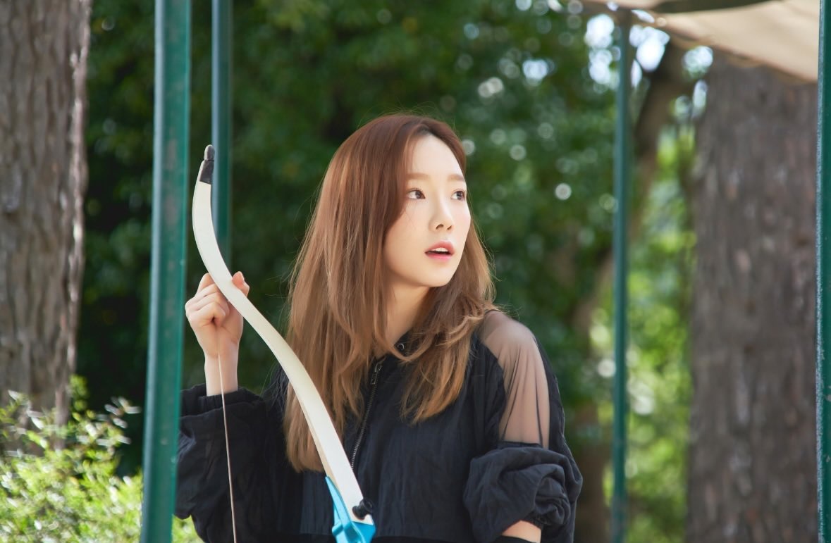 taeyeon posted a photo of her from girls for rest. this one was from when she did archery 🏹 is this random or is it a hint for something? 👀
