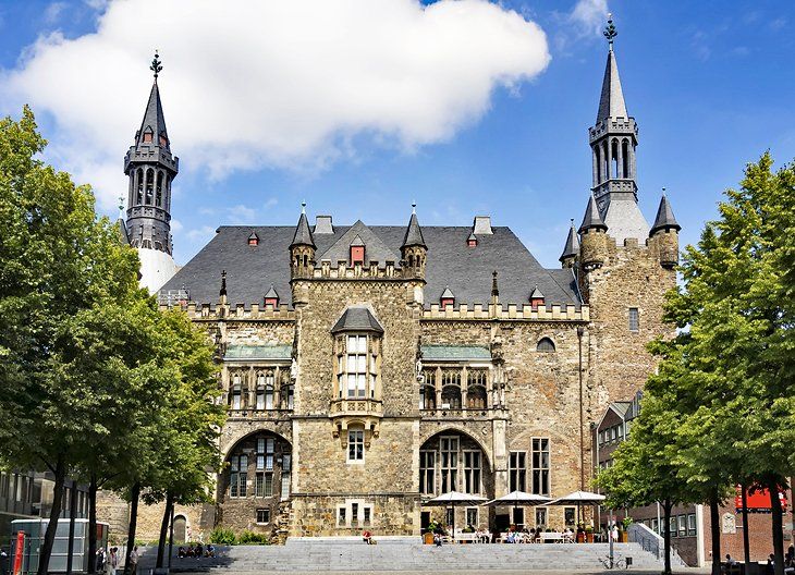 Elegant #Aachen-Town-Hall - the '#Rathaus' - is located directly opposite the city's cathedral and is equally important in terms of its architecture and history.  This castle-like structure officially became the town's administrative center around the mid 1300s. -SAVEATRAIN.COM