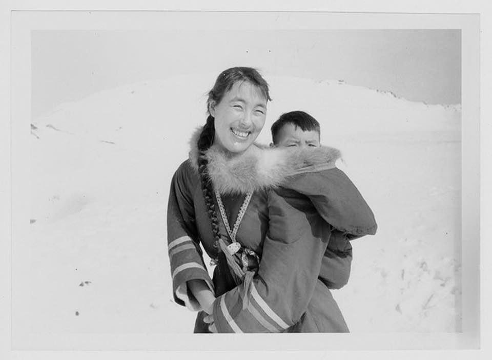 Annie Ikkidluak with Iola. Photographed at Kimmirut (Nunavut) in 1964. ‘Annie followed in the footsteps of her grandmother Iggalak to become local midwife.’ 📷 Freddie Knight | Hudson’s Bay Company Archives.