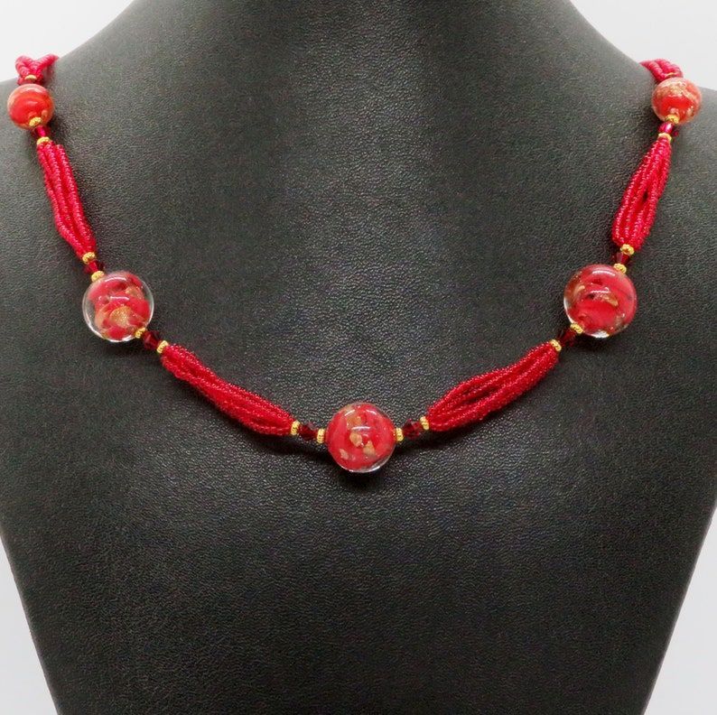 Handmade Venetian Glass Brilliant Red Necklace from RivendellRocksSedona - a statement piece that will make you stand out. Perfect for adding a pop of color to any outfit. #HandmadeJewelry #StatementNecklace buff.ly/3GkpD9m