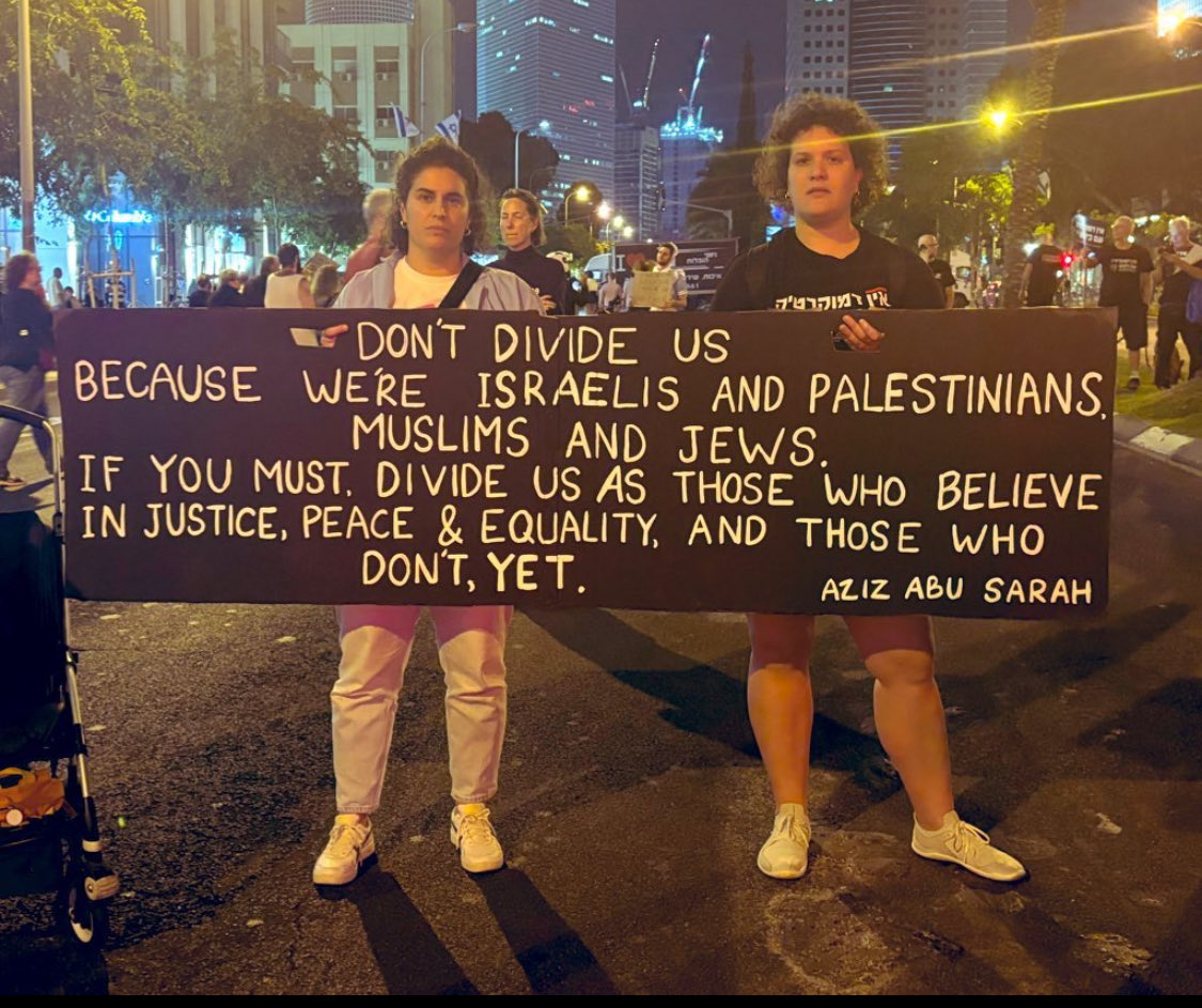 Protesters in Tel Aviv quoting my friend @AzizAbuSarah. Indeed.
