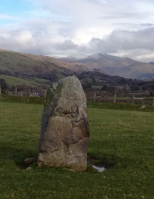 Today’s stone is six feet tall, worn smooth and black by sheltering sheep. (see next) Lovely views east towards Birds rock (Craig yr Aderyn) and off towards Cader Idris. (mirroring the landscape?) #StandingStoneSunday More 1/