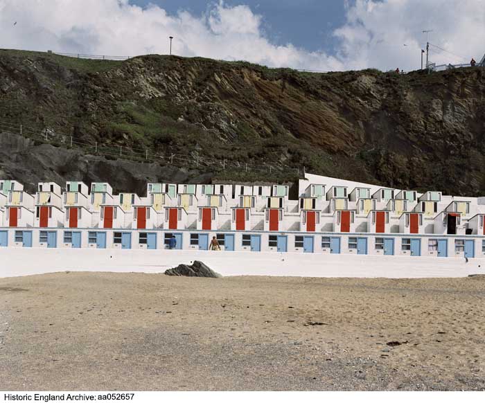 Photographed #OnThisDay in 2005, rows of beach huts at Tolcarne Beach, Newquay, Cornwall. You can see more Archive records of beach huts👇 historicengland.org.uk/images-books/p… #BeachHuts