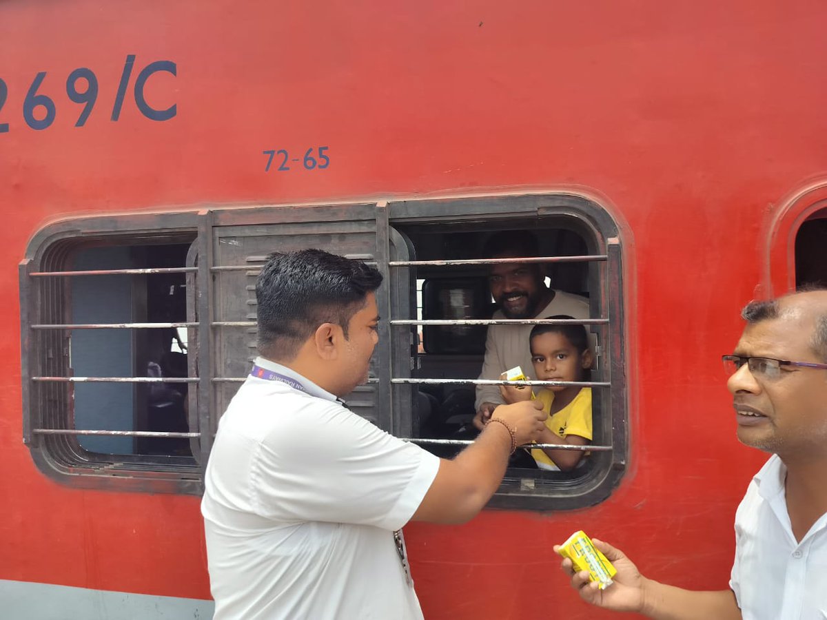 Considering surging temp and heat wave packets of frooti distributed to passengers by Commercial staff of 15018 kashi exp at Chalisgaon station
