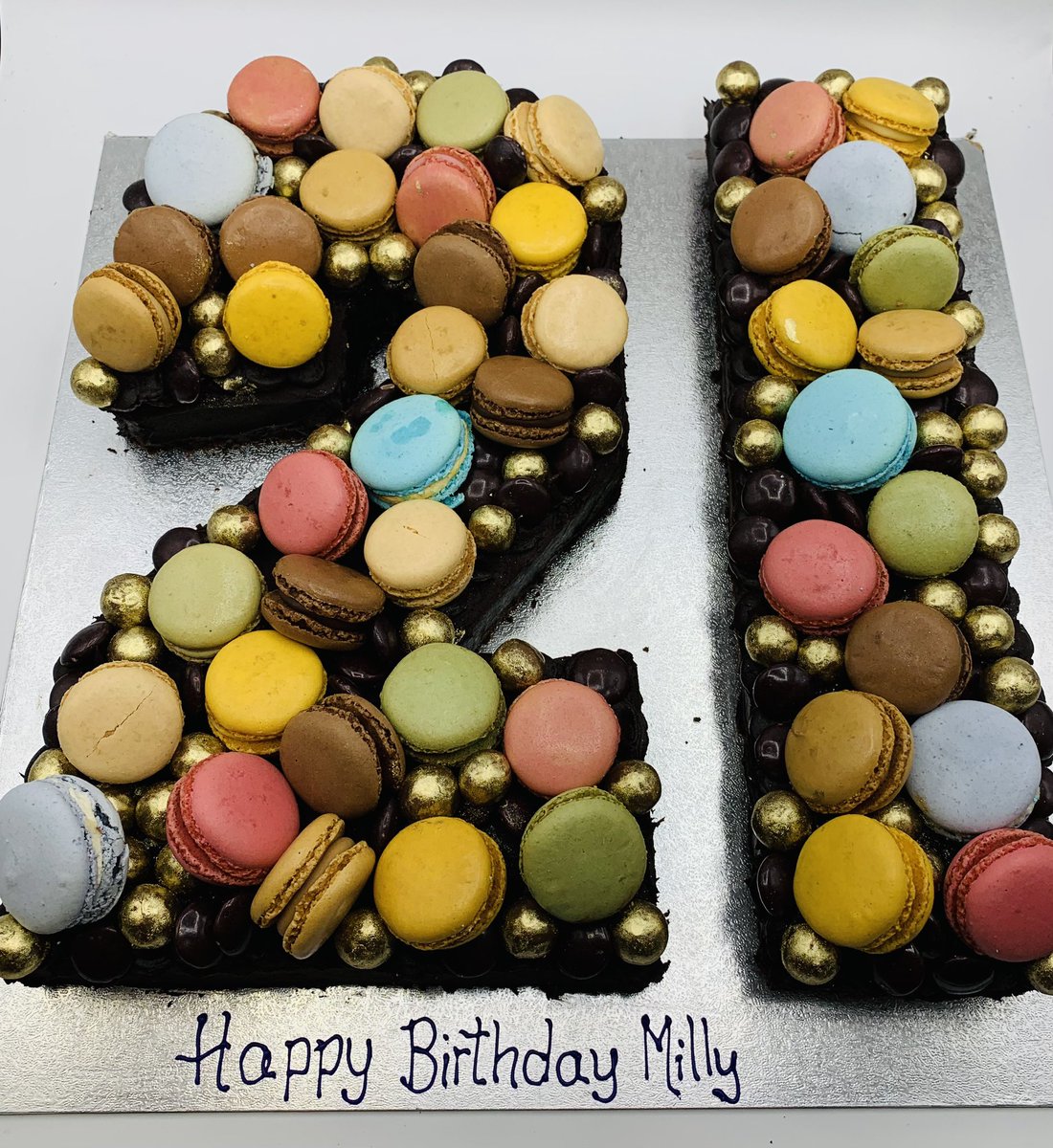A HUGE brownie loaded with macarons, Minstrels and gold Maltesers. You can tell by the number of macarons we used just how big this is!! It was delivered a college who won’t accept food deliveries so we disguised the packaging with a layer of brown paper! #indieoxford