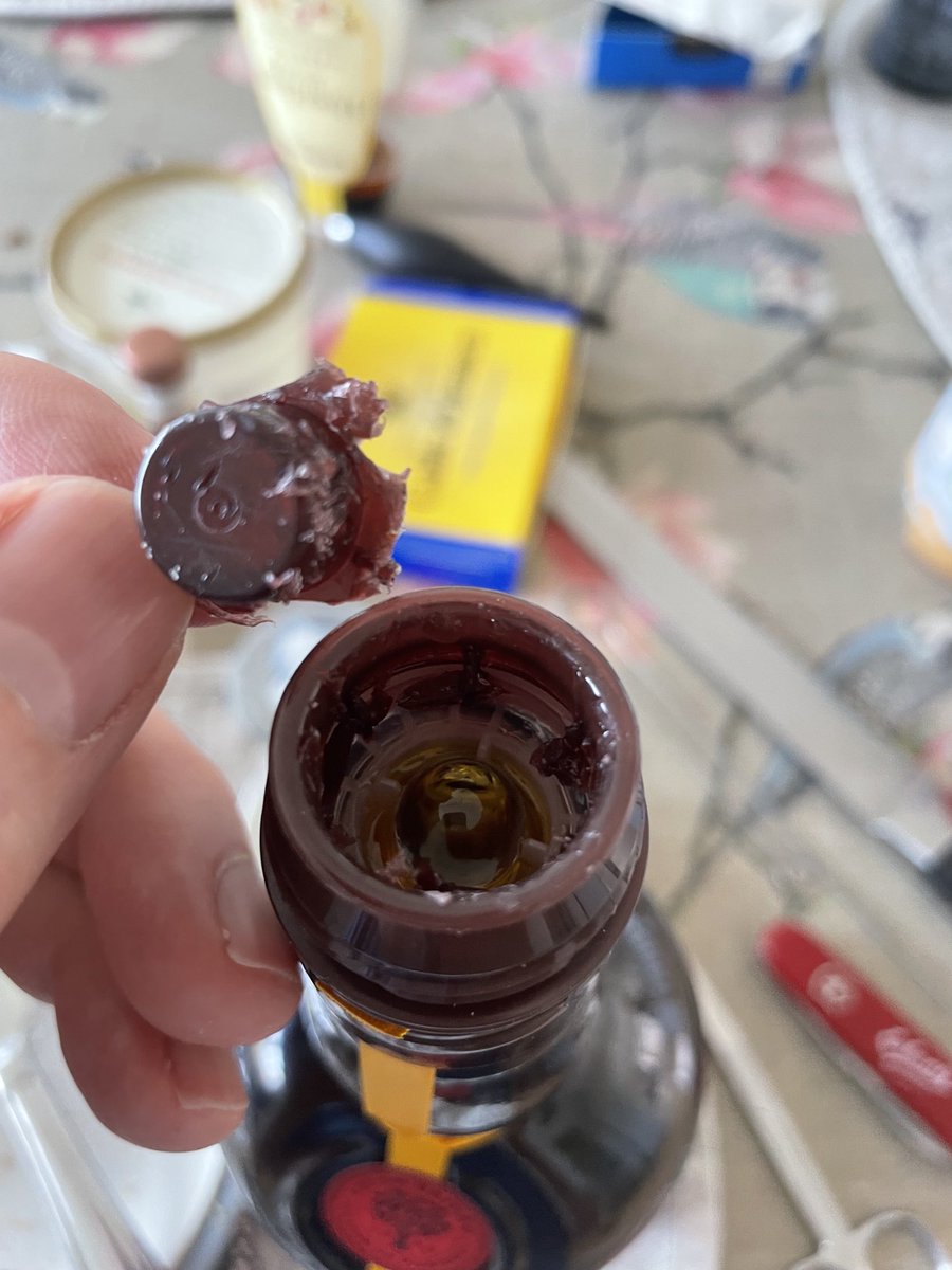 Going home from a wonderful #ElixirConfEU in Lisbon I got a Beirão liquor, but I could not get it to pour without totally cutting the top off. Then the small ball at the top does not stay put. I clearly did something wrong - any clues?