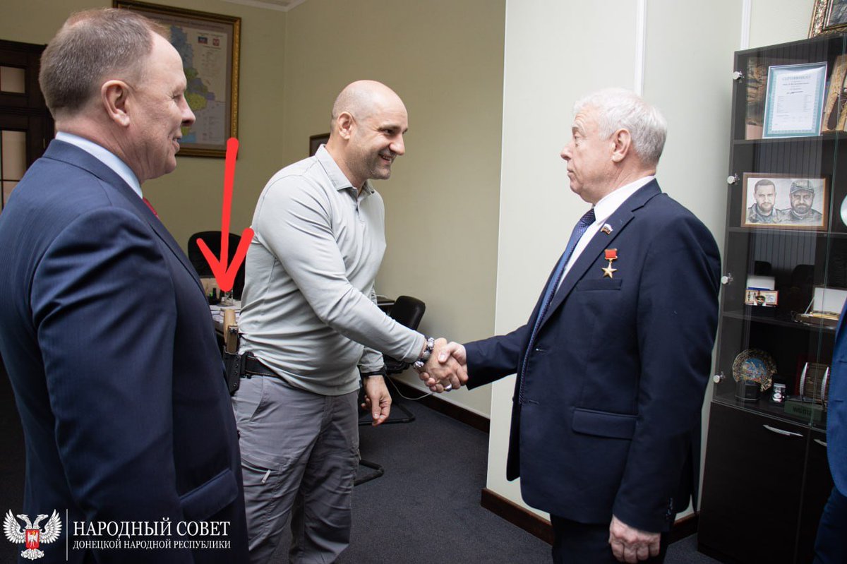This photo shows the political situation in the occupied territories, where ruzZian gangsters fight each other for power & control of illicit businesses. Artem Zhoga, Chairman of the People's Council in occupied Donetsk, walks around armed at all times even in his office. #lviv